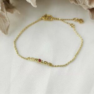 kate spade Love Gold-Toned Bracelet with Red Gemstone